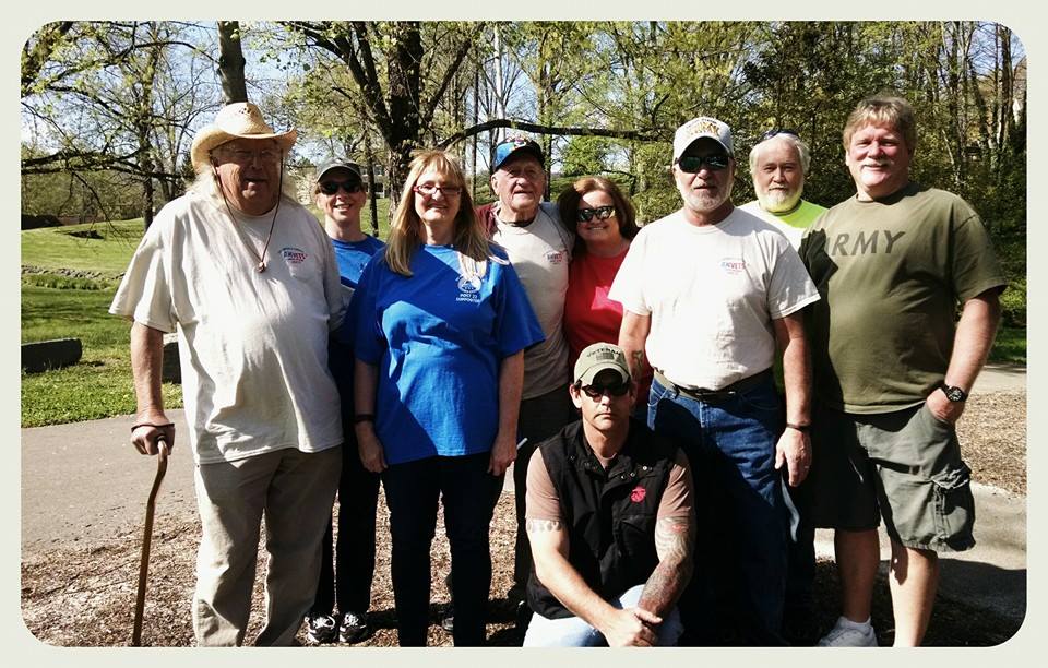 Image of nine participants standing together to smile for the camera
