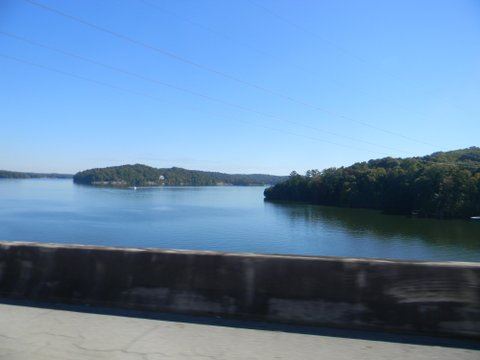 Image of flat lake with powerlines overhead