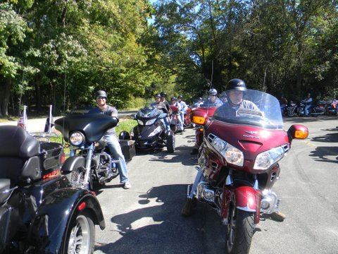 Line of motorcycles in parade formation on street