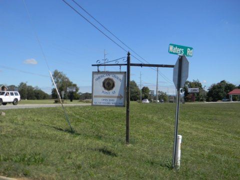 Image of American Legion sign post at Waters Road sign