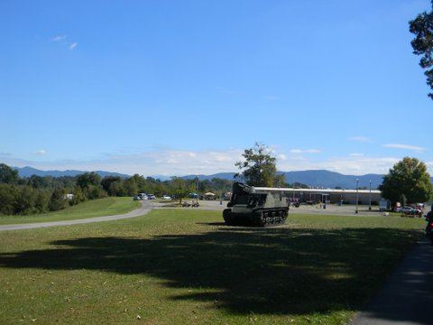 Image of field with tanker on grass, with blue skies