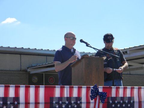 Nathan Weinbaum speaking at podium
